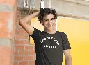 t-shirt-mockup-of-a-guy-smiling-and-grabbing-his-hair-a11594.webp