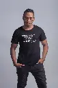Antoine_Beretto_t-shirt-mockup-of-a-serious-man-wearing-large-round-glasses-21056.webp