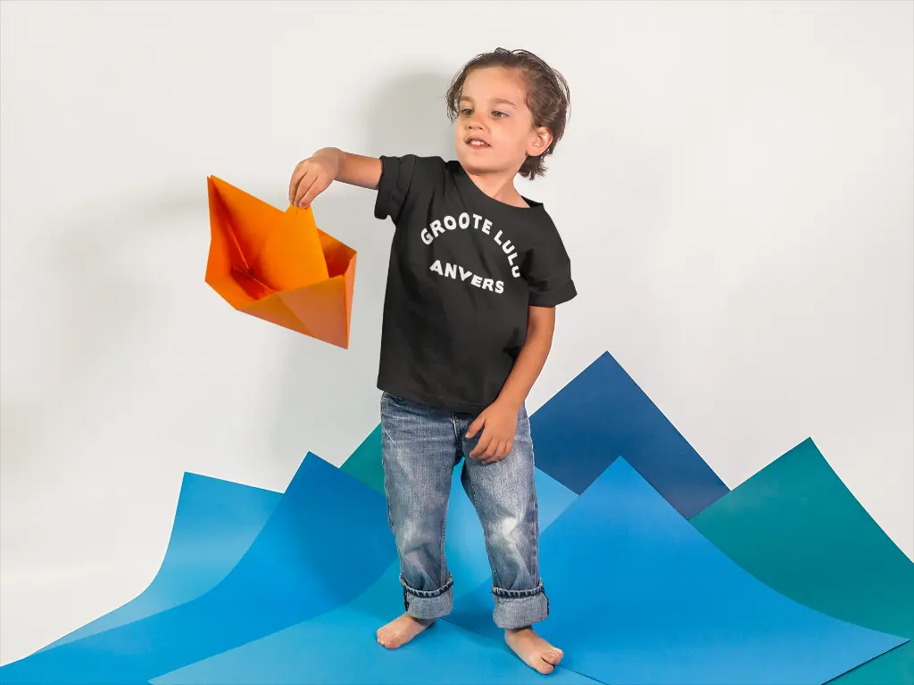 little-kid-playing-with-a-paper-boat-while-wearing-a-round-neck-tshirt-template-a16142.webp