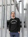 sweatshirt-mockup-featuring-a-man-outside-a-big-building-18099.webp
